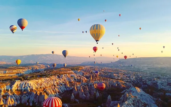 A view of Cappadocia with its fairy chimneys and hot air balloons